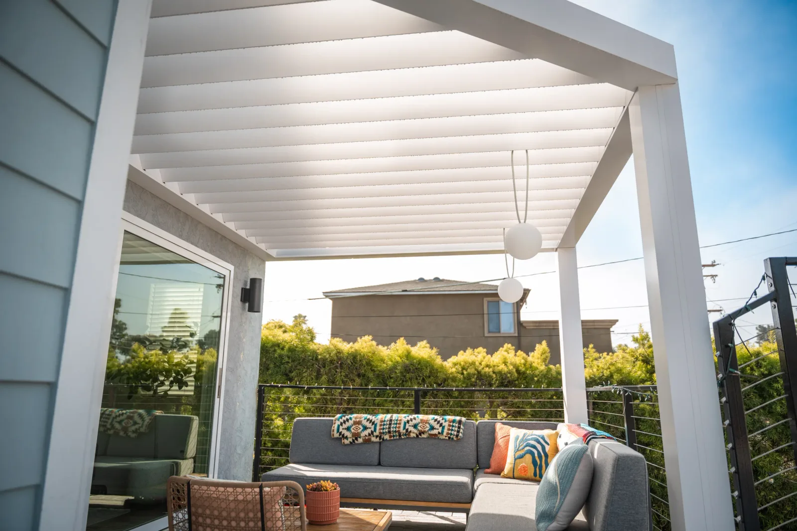 Azenco R-BREEZE roof structure over an outdoor space
